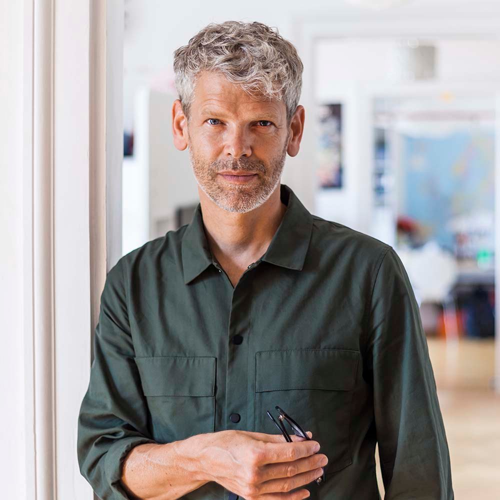 Portrait of mature man with grey hair and stubble n2fetgy.jpg